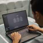 Person using ChatGPT on a laptop as companies increasingly adopt artificial intelligence tools in the workplace.