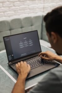 Person using ChatGPT on a laptop as companies increasingly adopt artificial intelligence tools in the workplace.