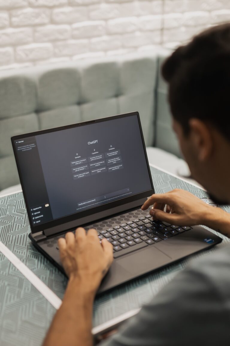 Person using ChatGPT on a laptop as companies increasingly adopt artificial intelligence tools in the workplace.