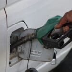 A vehicle being refueled with E20 petrol at a fuel station in India as part of the country's ethanol blending program.