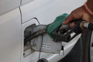 A vehicle being refueled with E20 petrol at a fuel station in India as part of the country's ethanol blending program.
