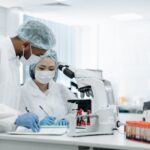 Scientists working in a biosafety laboratory analyzing infectious disease samples during an Ebola preparedness and vaccine research effort.