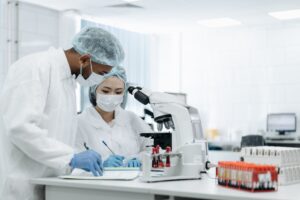 Scientists working in a biosafety laboratory analyzing infectious disease samples during an Ebola preparedness and vaccine research effort.