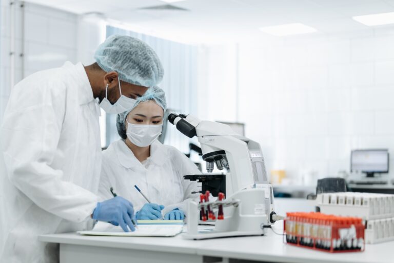 Scientists working in a biosafety laboratory analyzing infectious disease samples during an Ebola preparedness and vaccine research effort.