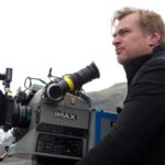 Christopher Nolan operating an IMAX camera during film production.