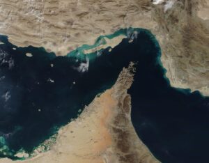 Satellite view of the Strait of Hormuz showing major global shipping lanes through one of the world's most important maritime chokepoints.