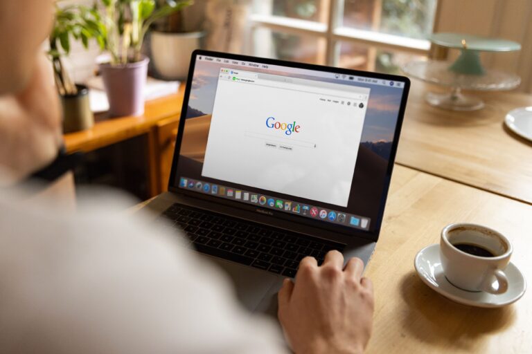 Person using Google Search on a laptop, illustrating how AI powered search is changing website traffic in the zero click economy.