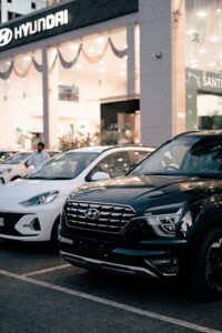 Large SUVs and cars displayed at a dealership, illustrating the shift away from affordable small cars.
