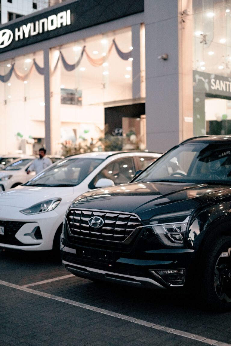 Large SUVs and cars displayed at a dealership, illustrating the shift away from affordable small cars.