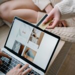 Person shopping online with a credit card while browsing products on a laptop, illustrating Buy Now Pay Later and digital checkout financing.