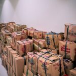 Large pile of packages in an ecommerce returns warehouse
