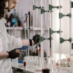Scientists conducting pharmaceutical research in a laboratory developing new medicines, illustrating the economic challenges of antibiotic innovation.