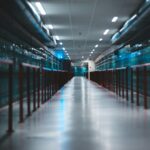 Long corridor inside a hyperscale data center with rows of AI server infrastructure