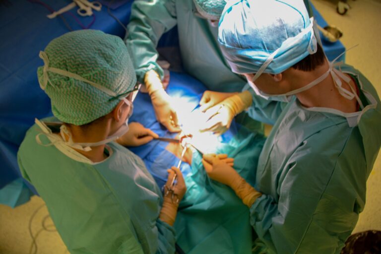 Surgeons performing an organ transplant operation in an operating room