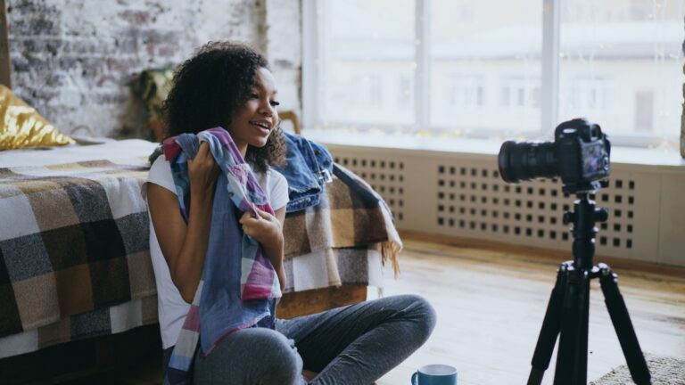 Child creating video content with a camera on a tripod