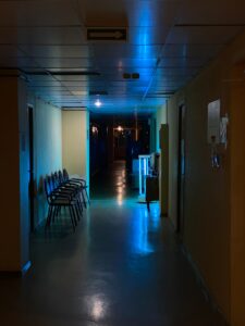 Dark hospital corridor illustrating patient safety risks and medical harm
