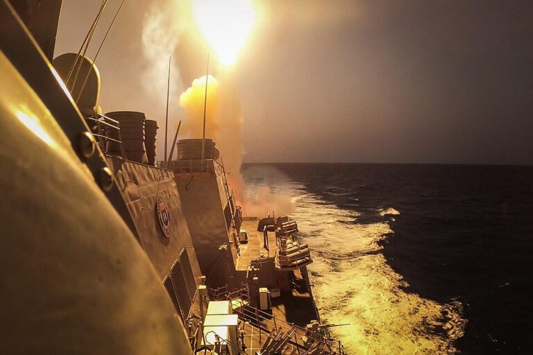 Missile launching from a U.S. Navy warship at sea, illustrating the cost of naval air defense against drone threats.