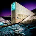 Interior of the Svalbard Global Seed Vault showing its concrete structure and illuminated access corridor.